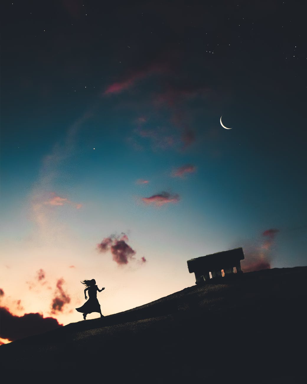 Picture of woman running on a hill under the sky with stars